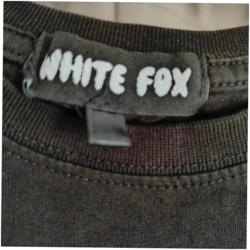 White Fox black graphic t-shirt with neon pink "Vol.3" logo and ribbed neckline.