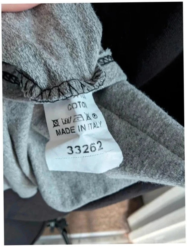 new collection made in Italy black grey asymmetric hoodie dress with metallic graphic print and zipper.
