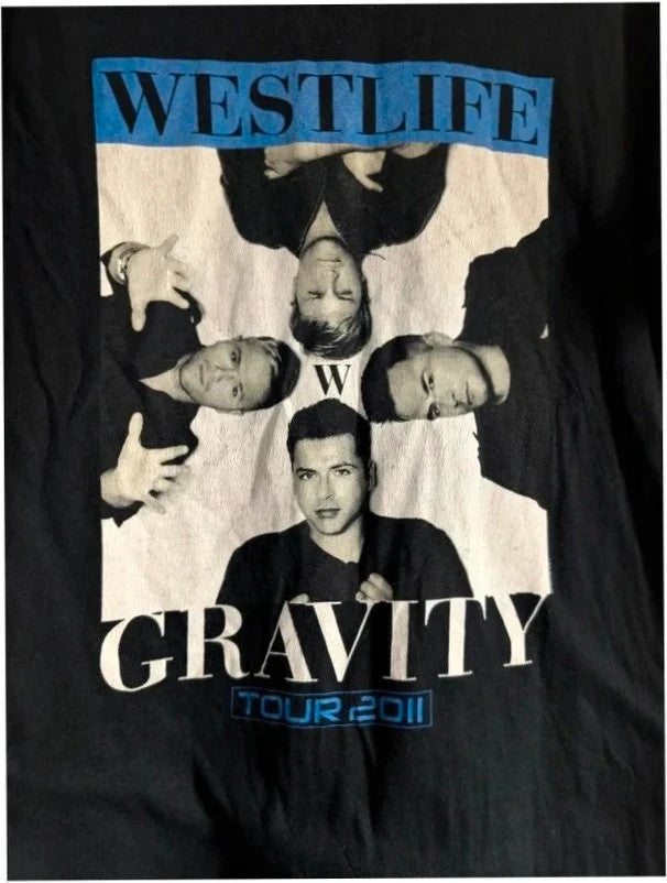 Gildan black graphic t-shirt featuring Westlife band photo print and tour dates in blue.