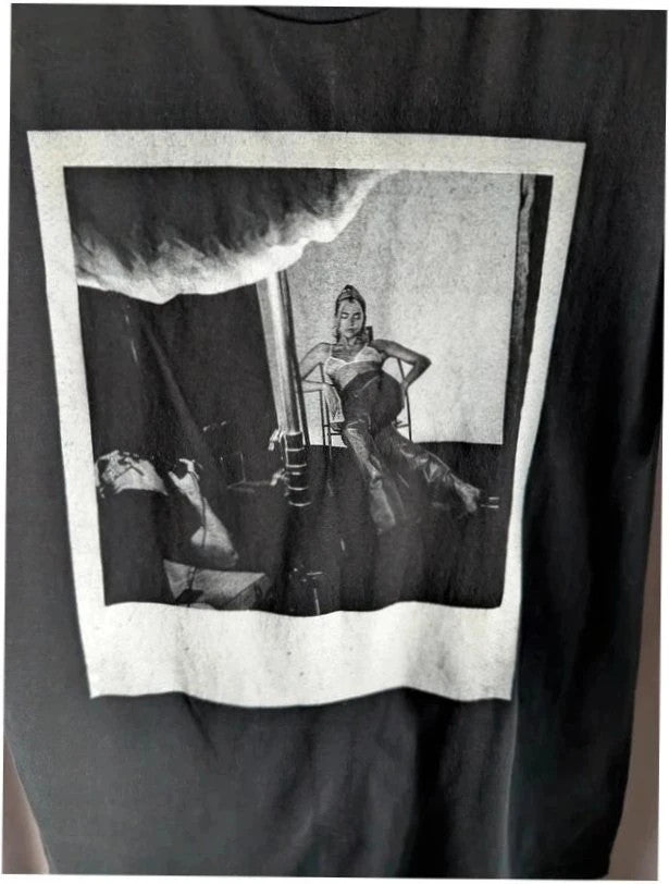 Dua Lipa black graphic tee with front polaroid print and back tour dates list.