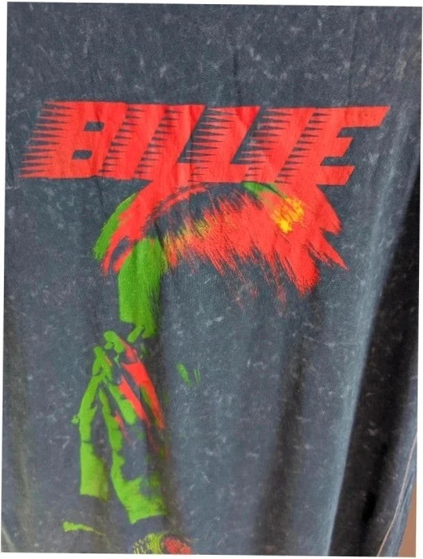 Billie Eilish blue acid wash pocket t-shirt with multicolour graphic and red text.