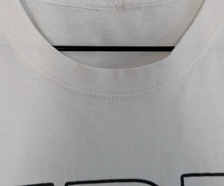 Y2K white pocket t-shirt featuring Girls Aloud band graphic and typography print.