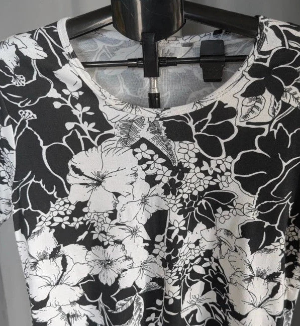 ISLE black white floral graphic t-shirt with rhinestone accents and hibiscus pattern.