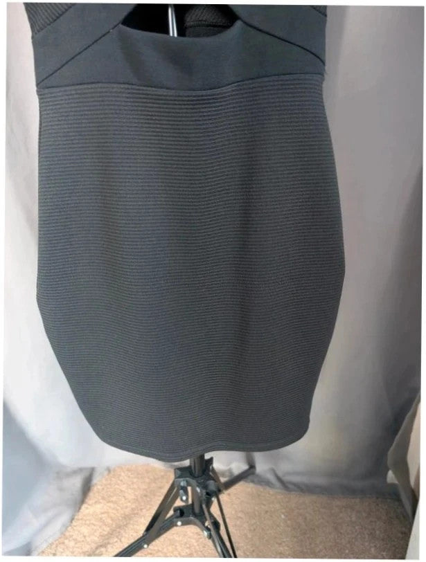 River Island black bodycon mini dress with ribbed texture and midriff cut-out detail.
