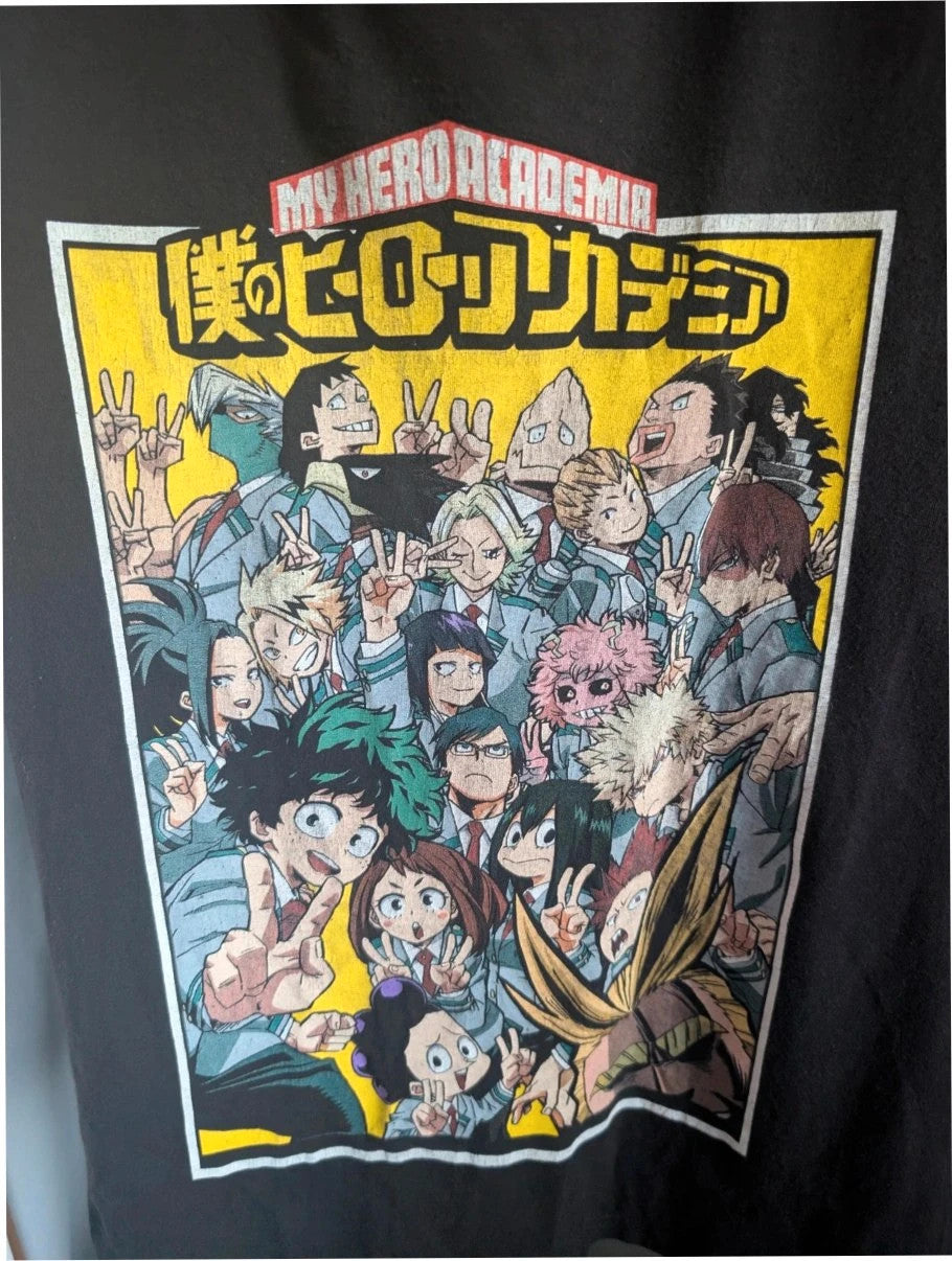 My Hero Academia black graphic tee featuring vibrant comic art panel and dual language title.