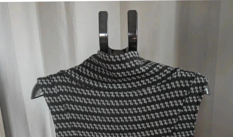 Apricot black and grey knit tunic dress with cowl neck and geometric pattern.