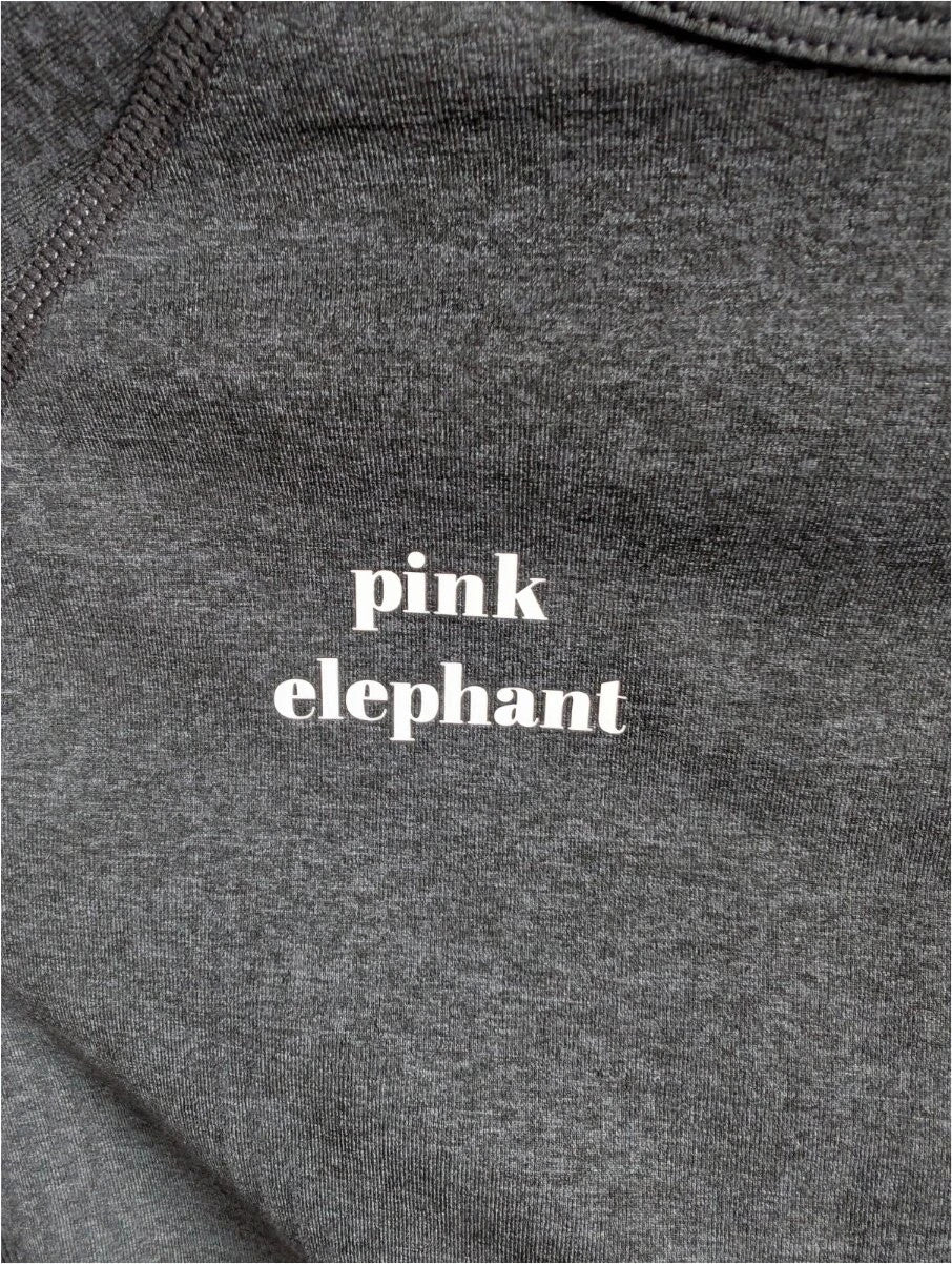 Pink Elephant black gym crop top with white logo, seamless design, and thumbhole cuffs.