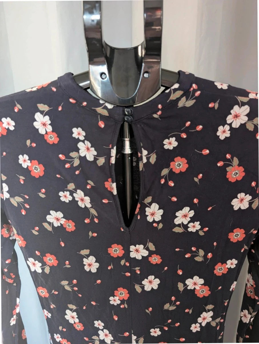 M&S COLLECTION navy blue floral mini dress with high neck and long sleeves.