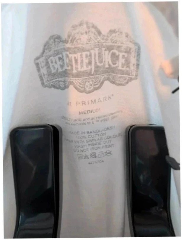Primark black graphic t-shirt featuring Beetlejuice movie prints on front and back.