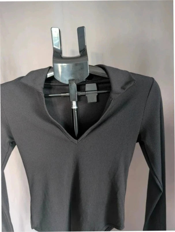 Select black ribbed long sleeve collared bodysuit with deep v-neck and popper fastenings.