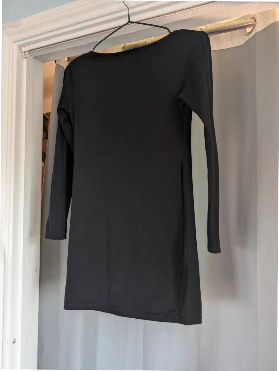 PrettyLittleThing black long sleeve bodycon mini dress with notch neck and fitted sleeves.