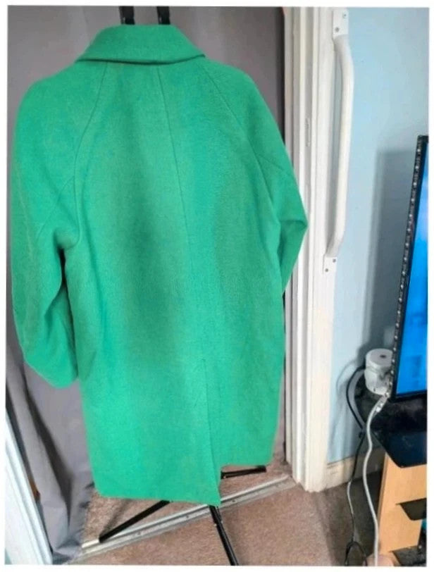 H&M green longline coat with structured shoulders and notch lapel collar.