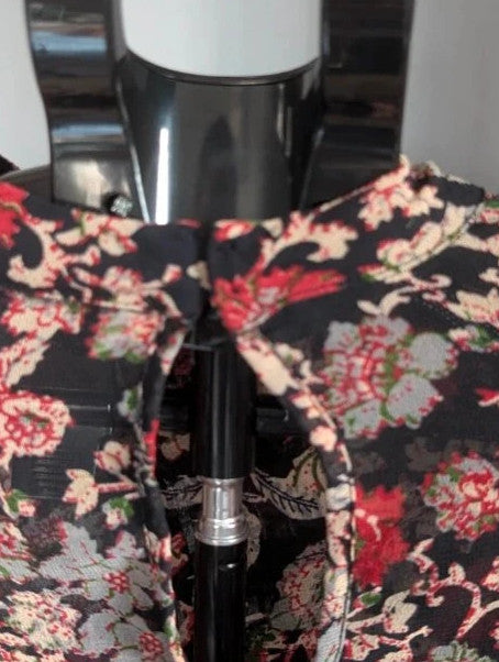 Zara black floral chiffon tunic blouse with tiered ruffle bib and crochet lace details.