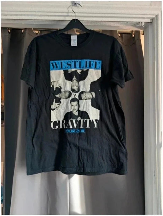 Gildan black graphic t-shirt featuring Westlife band photo print and tour dates in blue.