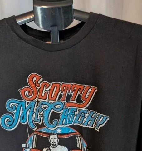 Scotty McCreery black graphic tee featuring retro artwork and US tour dates on back.