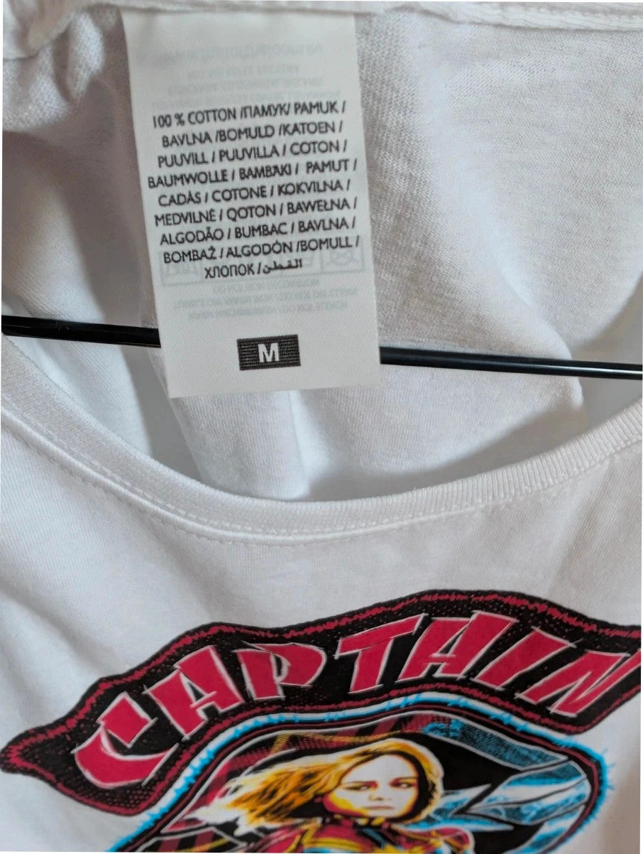 Marvel white graphic t-shirt featuring Captain Marvel print and retro patch-style lettering.