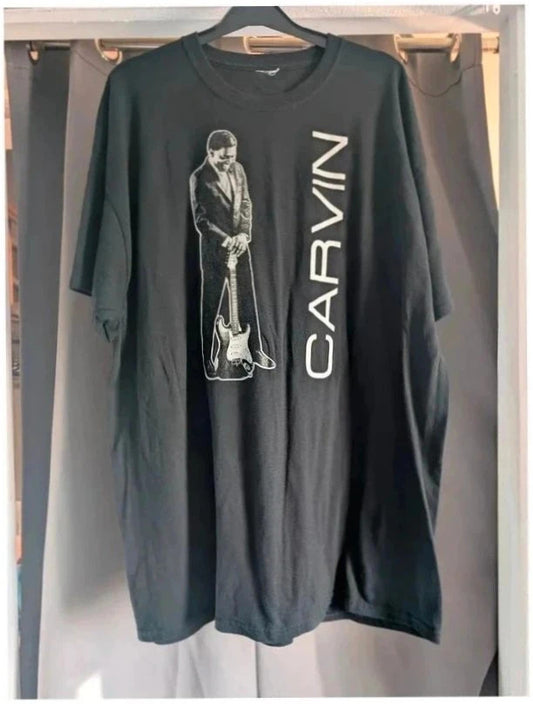 Official Carvin Jones black graphic tee featuring bold guitar artwork and tour dates print.
