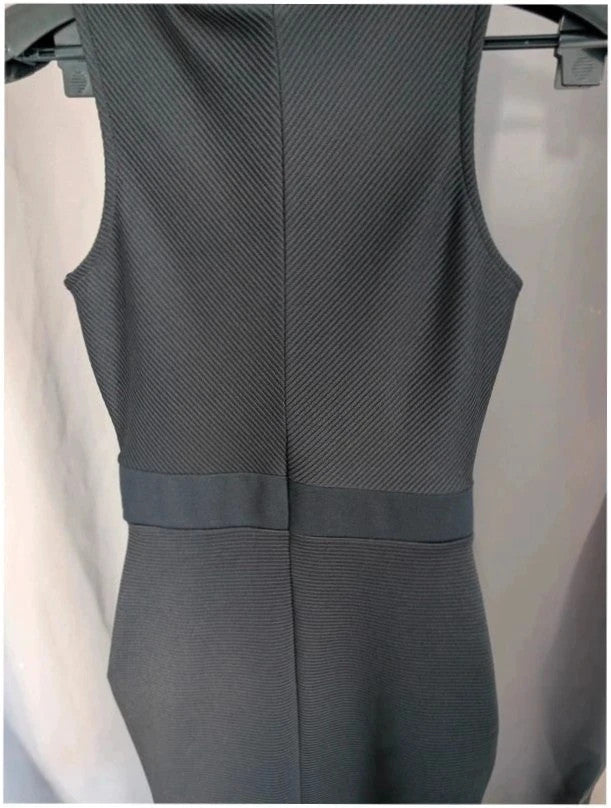 River Island black bodycon mini dress with ribbed texture and midriff cut-out detail.