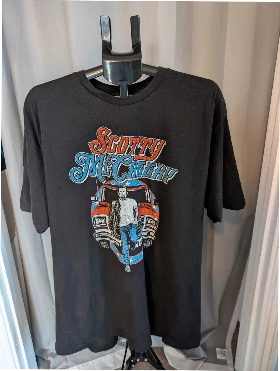 Scotty McCreery black graphic tee with retro truck artwork and tour dates on back.