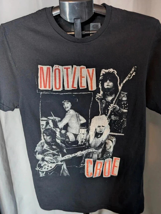 Mötley Crüe black graphic tee featuring retro collage artwork and red block logo.