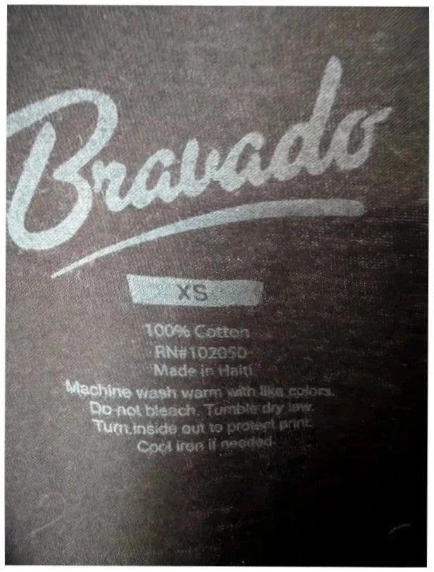 Bravado black graphic t-shirt featuring Cher portrait print with pink and blue accents.