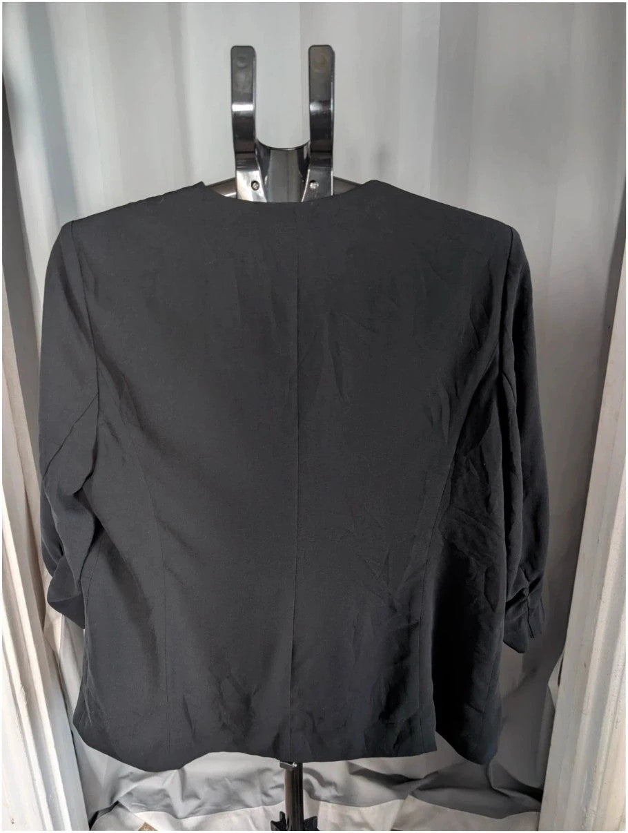 Marks & Spencer black blazer jacket with ruched sleeves and collarless design.