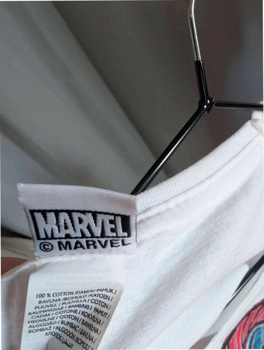 Marvel white graphic t-shirt featuring Captain Marvel print and retro patch-style lettering.