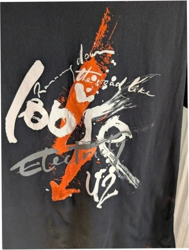 edun live black graphic t-shirt with vibrant orange U2 360 Tour prints front and back