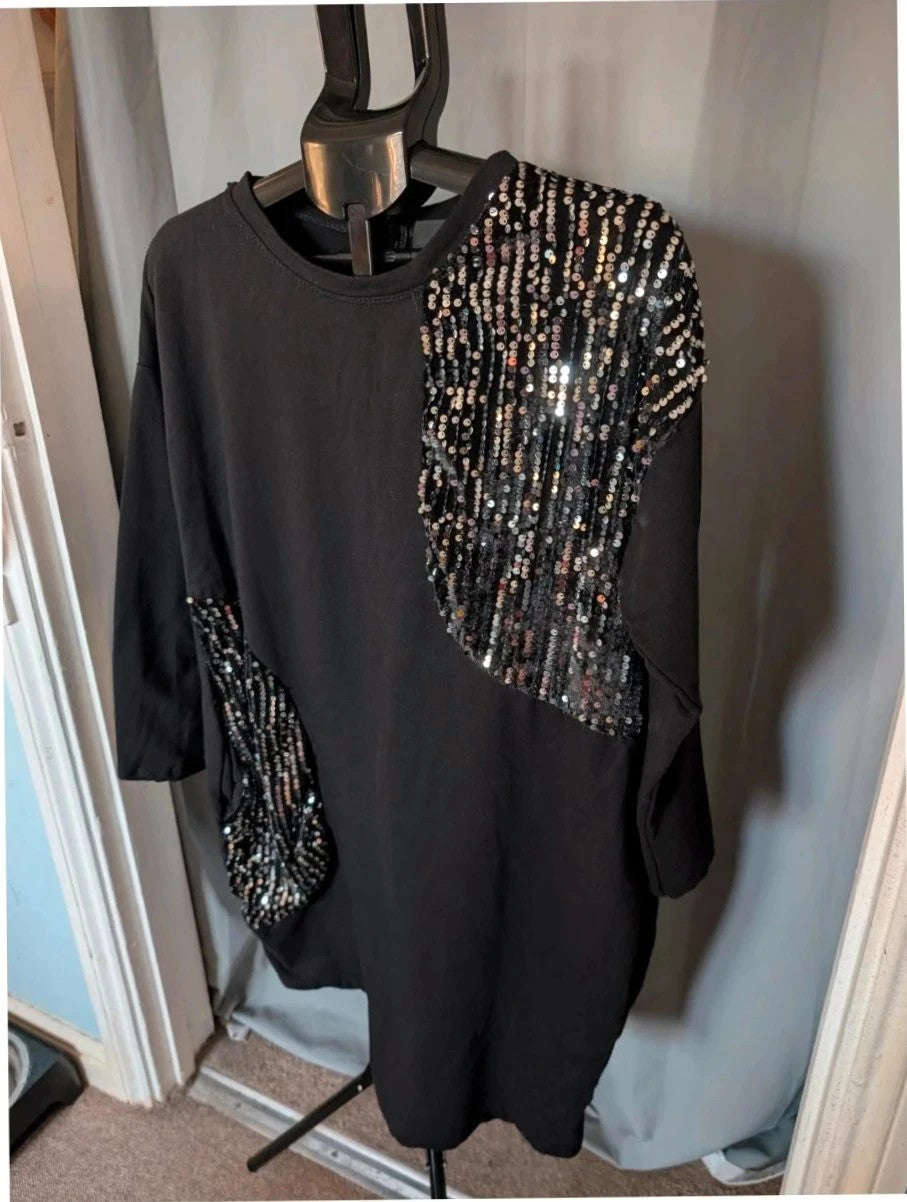 New Collection black tunic dress with silver sequin panels and relaxed crew neckline.