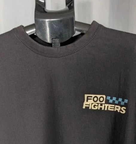 Foo Fighters black graphic tee featuring coiling snake design and blue checkerboard pattern.