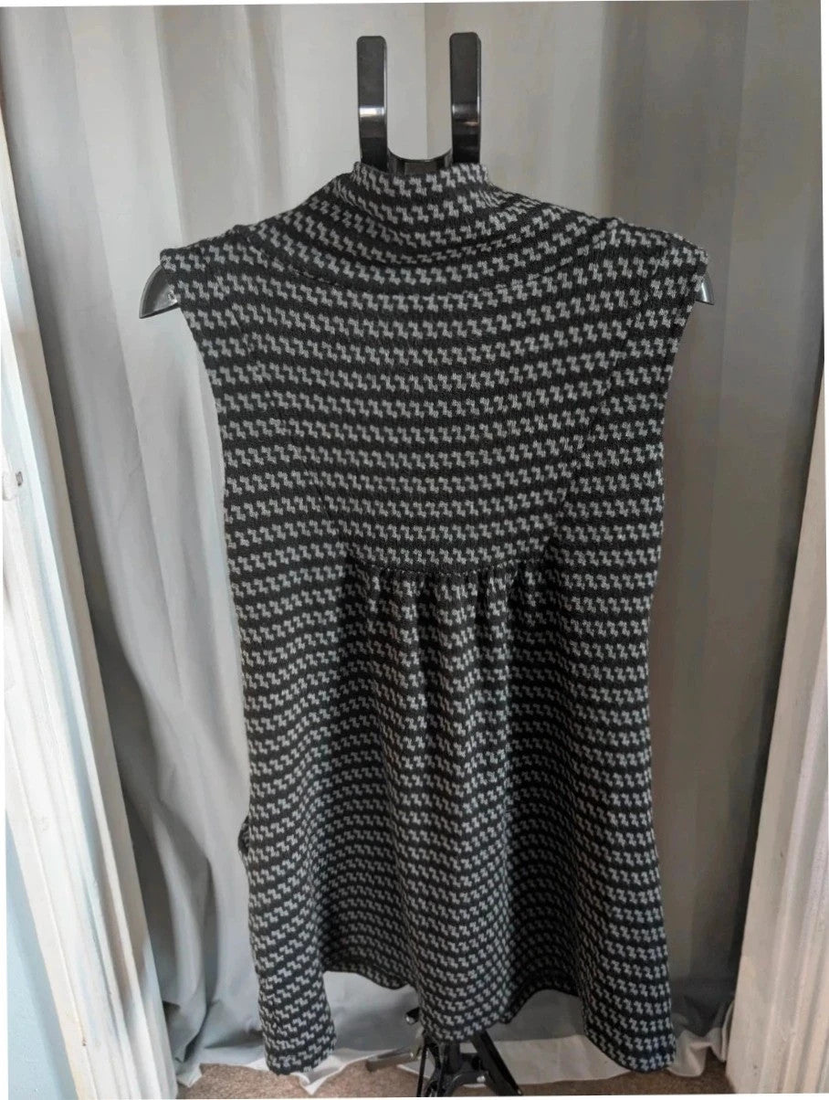 Apricot black and grey knit tunic dress with cowl neck and geometric pattern.
