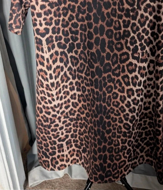 Peacocks leopard print shift mini dress in black and brown with short sleeves and scoop neckline.