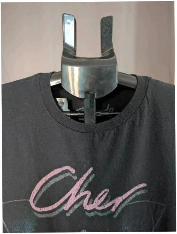 Bravado black graphic t-shirt featuring Cher portrait print with pink and blue accents.