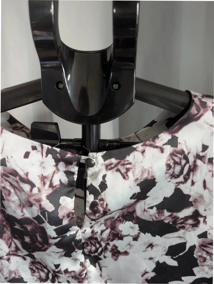 NaaNaa black satin crop top with floral print and eyelash lace trim.