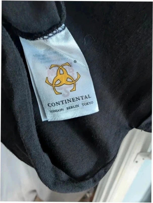 Continental black men's graphic t-shirt featuring bold yellow All Time Low logo print.