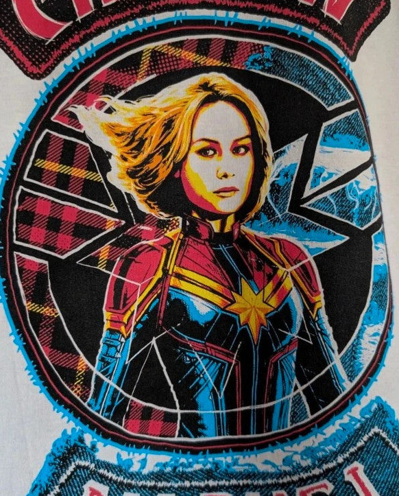 Marvel white graphic t-shirt featuring Captain Marvel print and retro patch-style lettering.