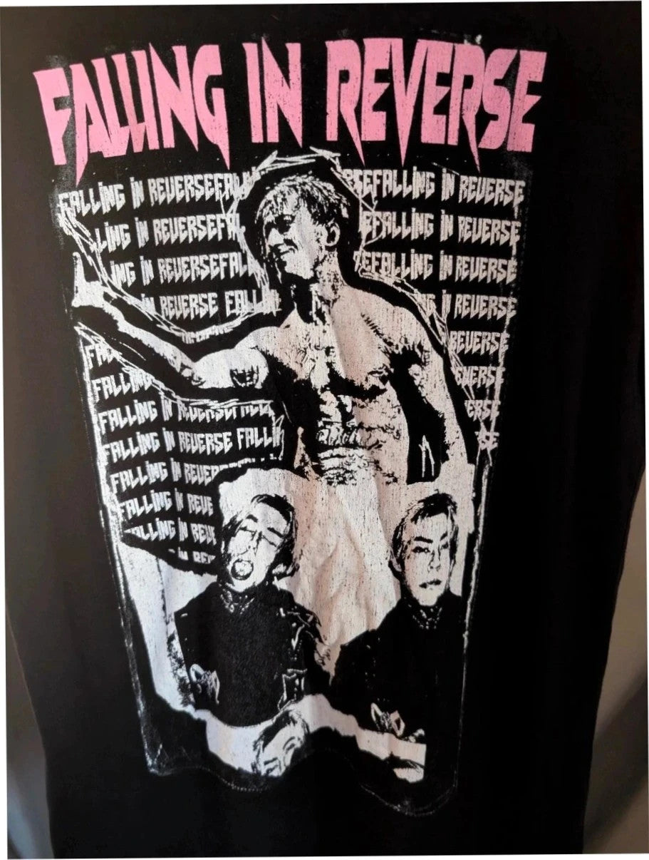 Next Level black graphic tee featuring Falling In Reverse pink logo and band portrait.