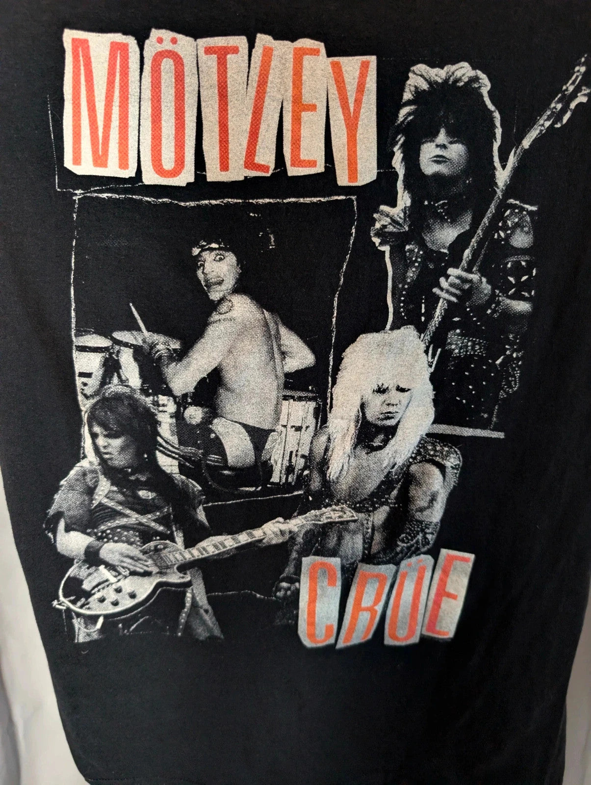 Mötley Crüe black graphic tee featuring retro band collage and red logo lettering.
