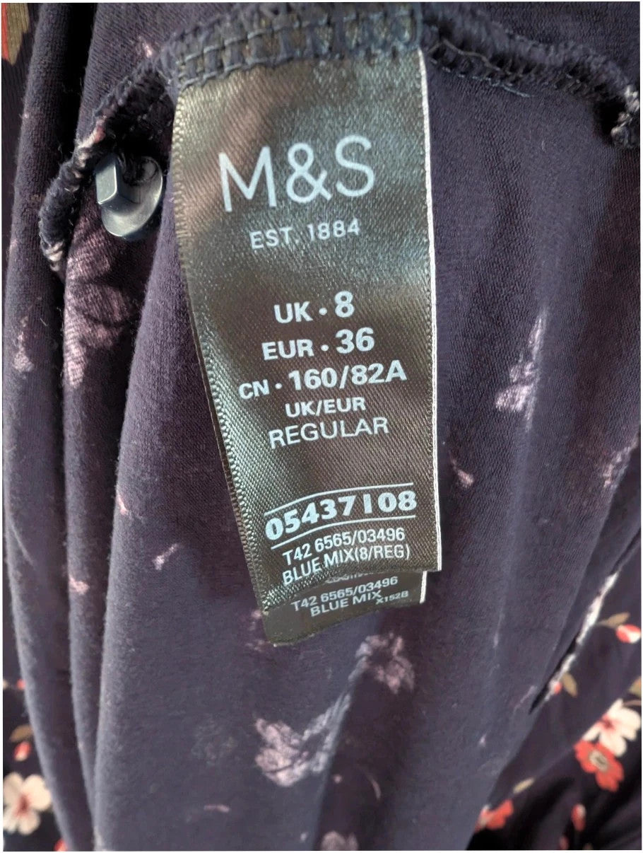 M&S COLLECTION navy blue floral mini dress with high neck and long sleeves.