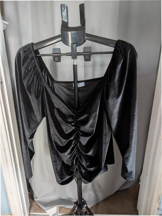 Papaya black stretch velvet tunic blouse with ruched sweetheart bustline and puff shoulders.