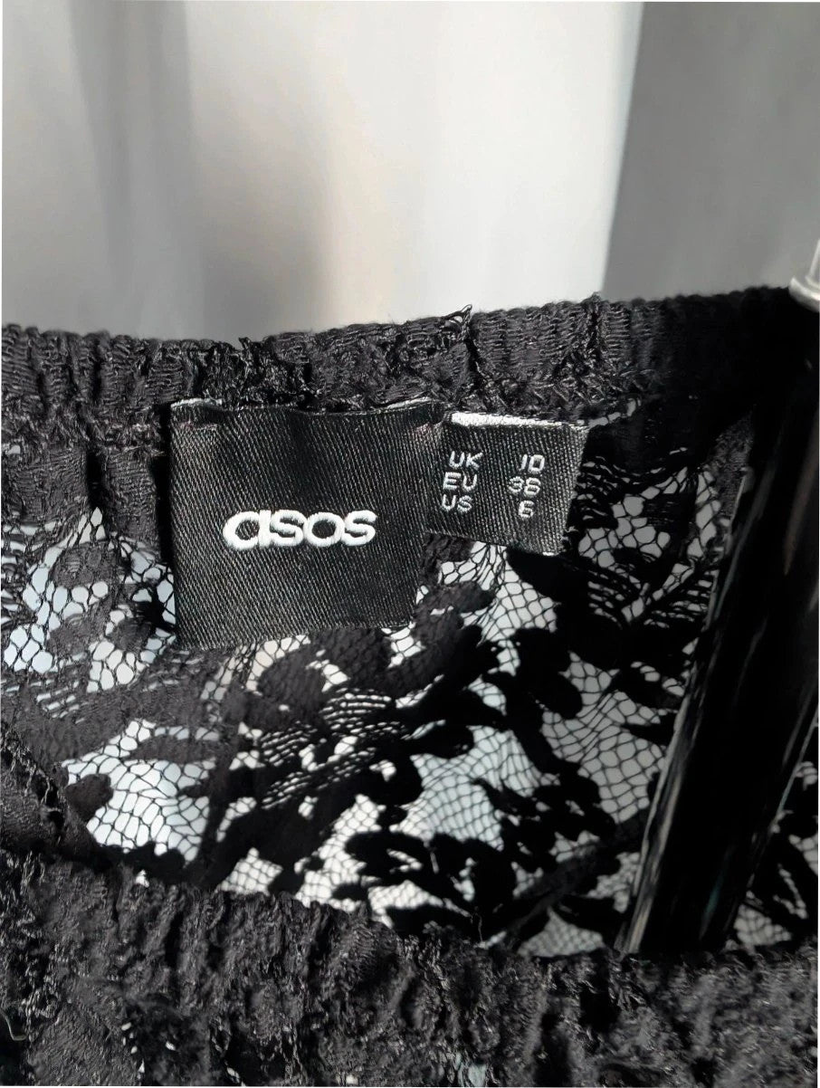 ASOS black sheer floral lace crop top with off-the-shoulder Bardot neckline and puff sleeves.