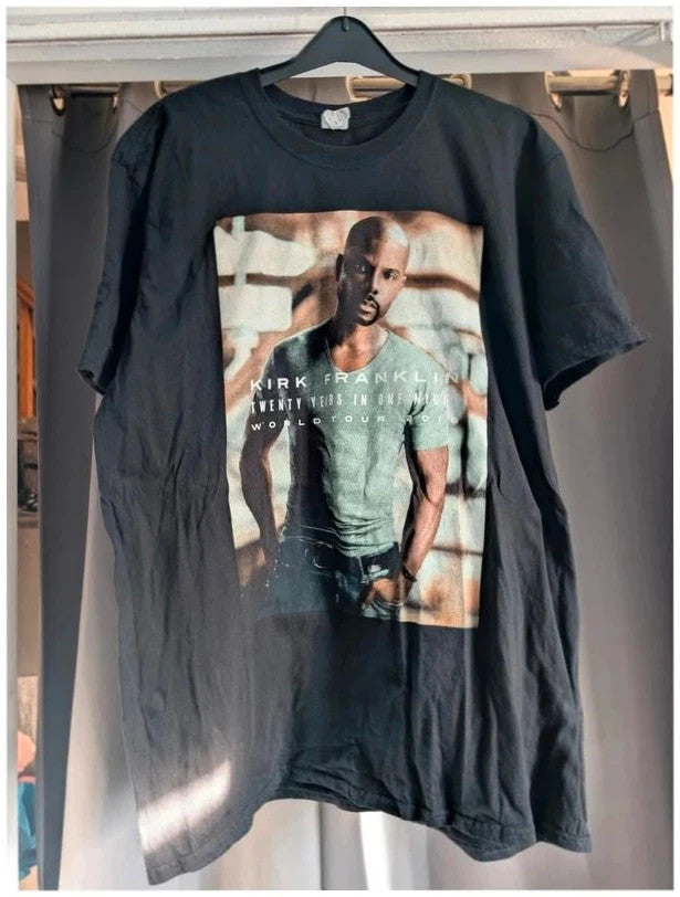 Zion Rootswear black graphic t-shirt featuring Bob Marley portraits and distressed Rasta font.