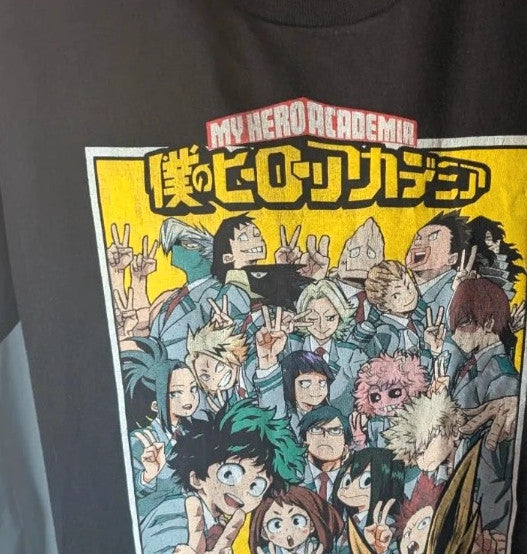 My Hero Academia black graphic tee featuring vibrant comic art panel and dual language title.