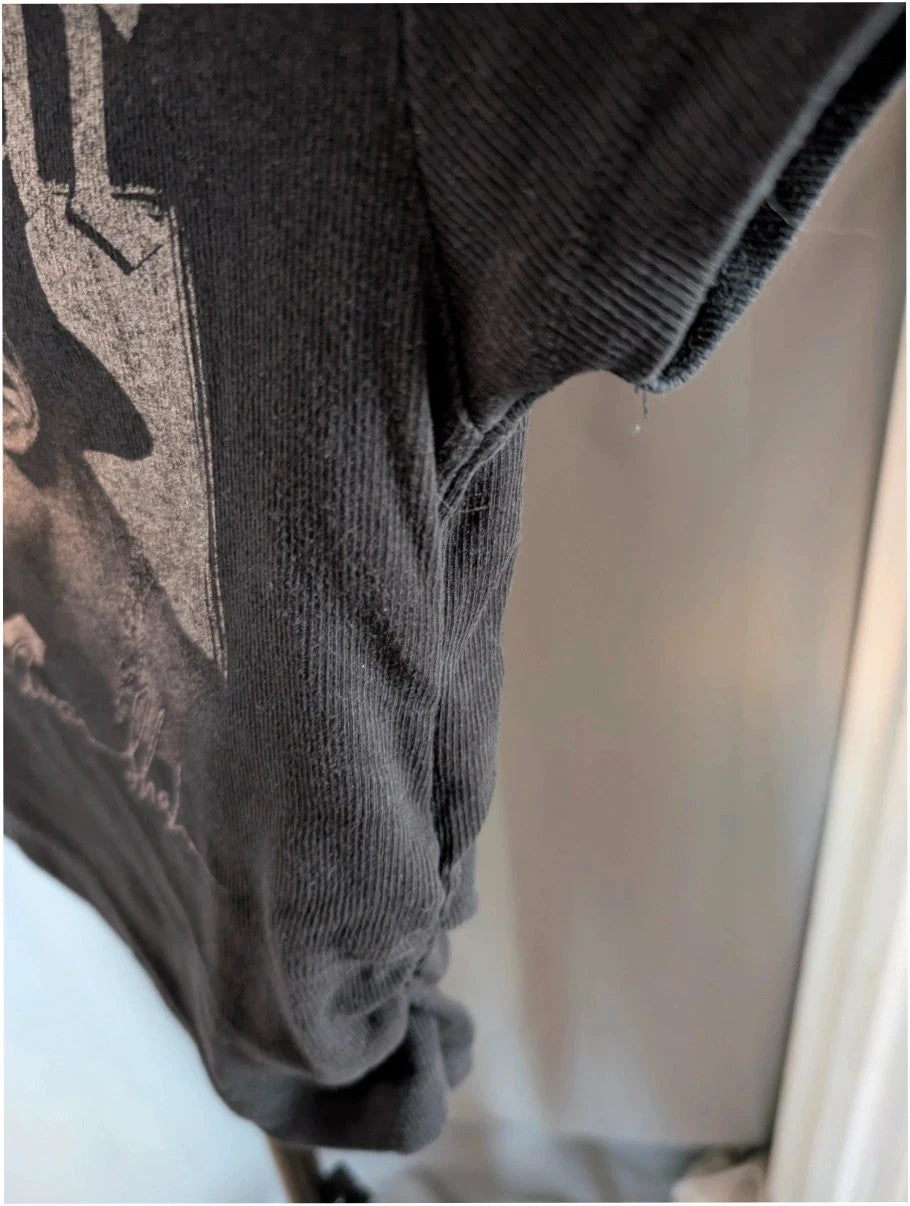 Primark black crop top featuring Tupac portrait graphic and ruched side detailing.