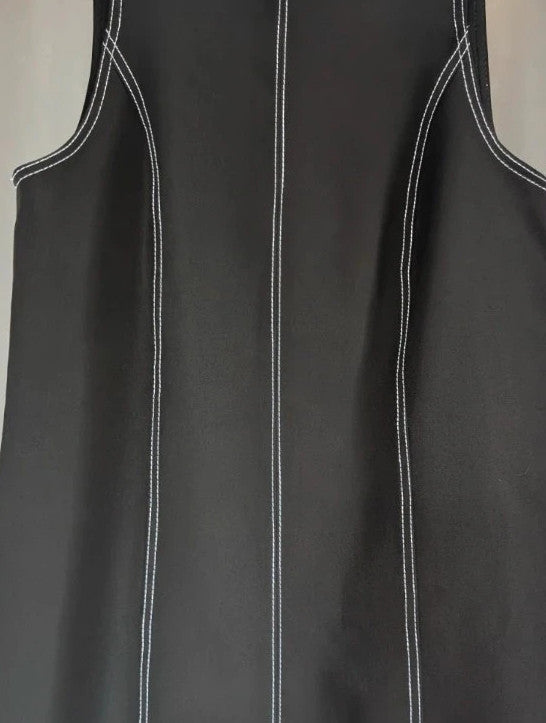 River Island black sleeveless mini dress with white contrast stitching and mock neck collar.