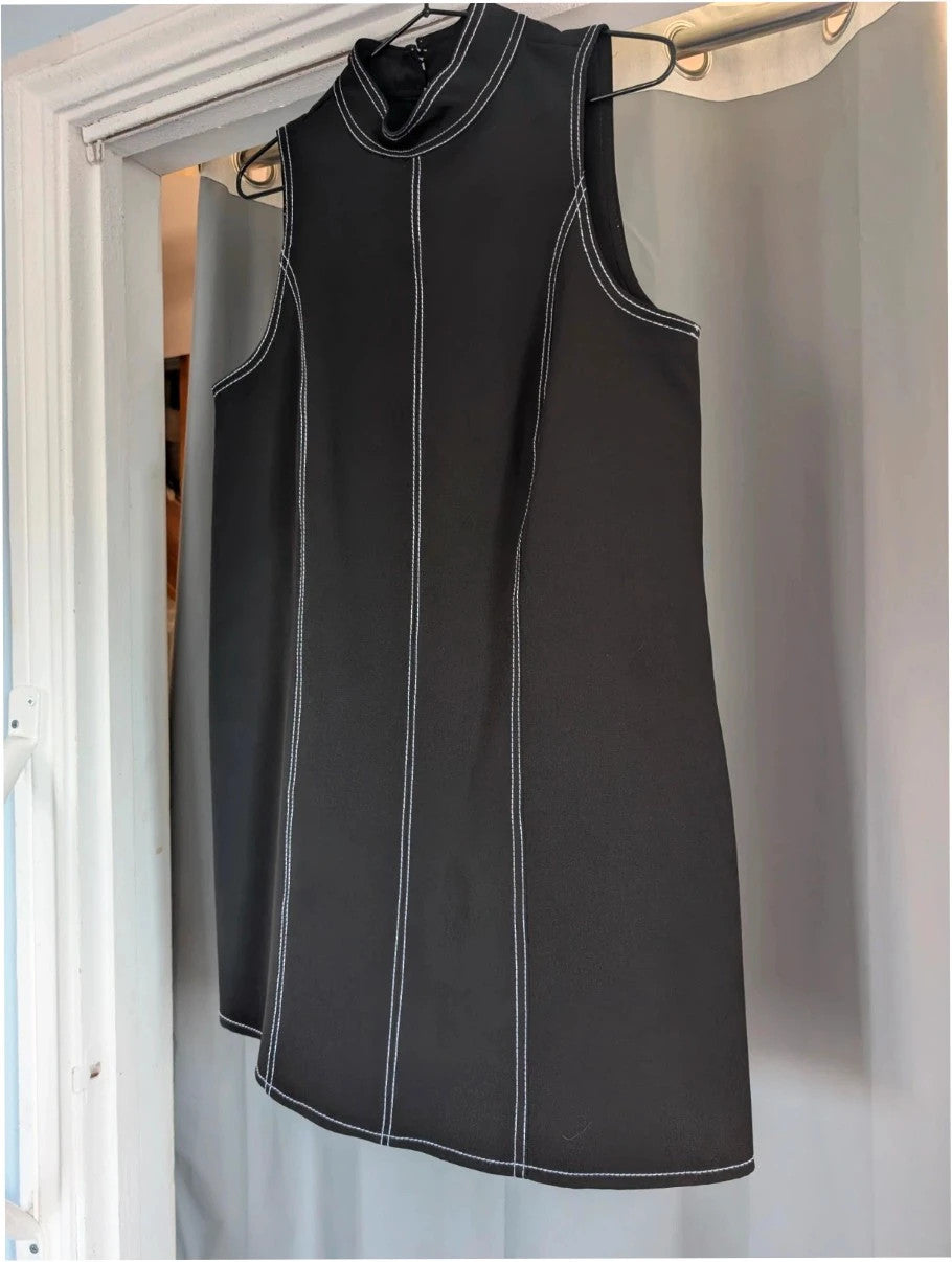 River Island black sleeveless mini dress with white contrast stitching and mock neck collar.