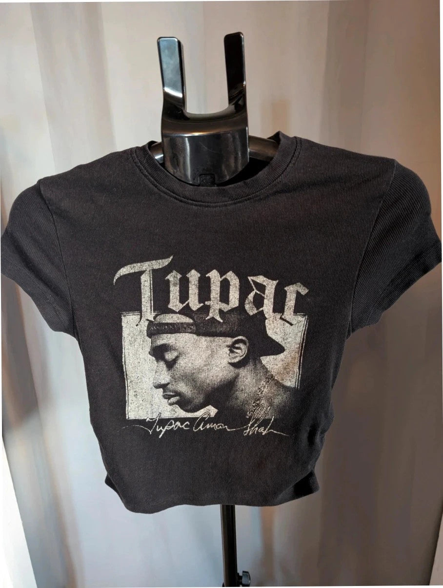 Primark black crop top featuring Tupac portrait graphic and ruched side detailing.