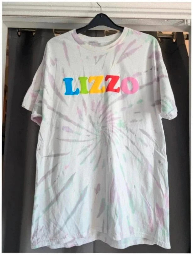 Lizzo Official Merch graphic t-shirt, white with pastel tie-dye and foam puff print logo.
