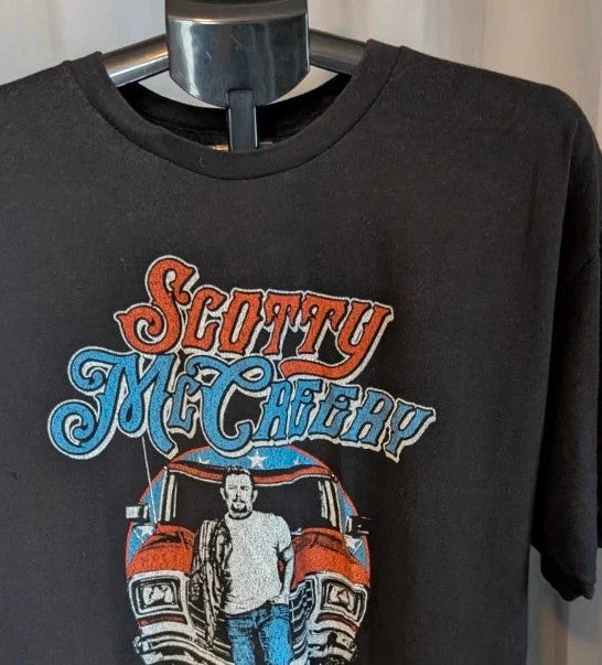 Scotty McCreery black graphic tee with retro truck artwork and tour dates on back.