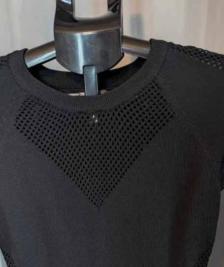 Blue Vanilla black bodycon mini dress with mesh cutouts and ribbed neckline.